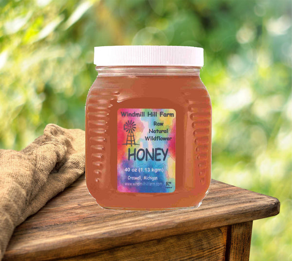 40 oz square fancy glass jar of wildflower honey.