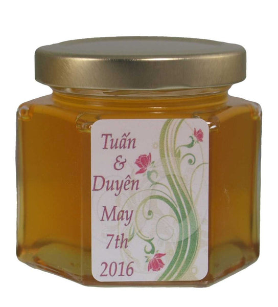 6 oz Hex Jar of wildflower honey. This is a perfect size for party